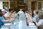 Family Gathered Around Farm Table_Hull-O Farms